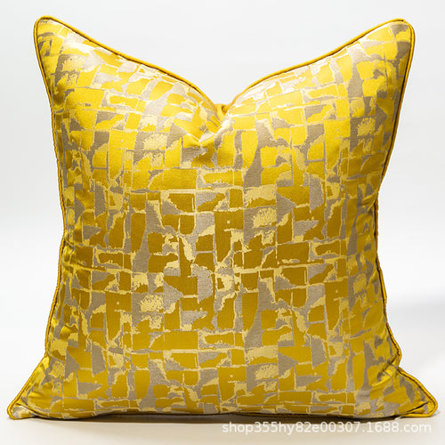 Yellow patterned pillow on a white background