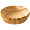 Set of gold foil cupcake liners on a white background