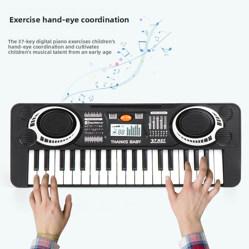 37-key digital piano with hands playing on a white background