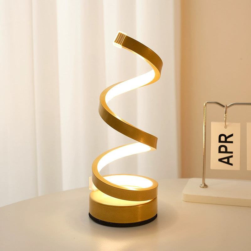 Spiral design table lamp on a surface with a neutral background
