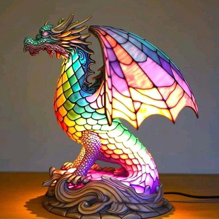 Colorful dragon-shaped lamp with stained glass effect on a plain background