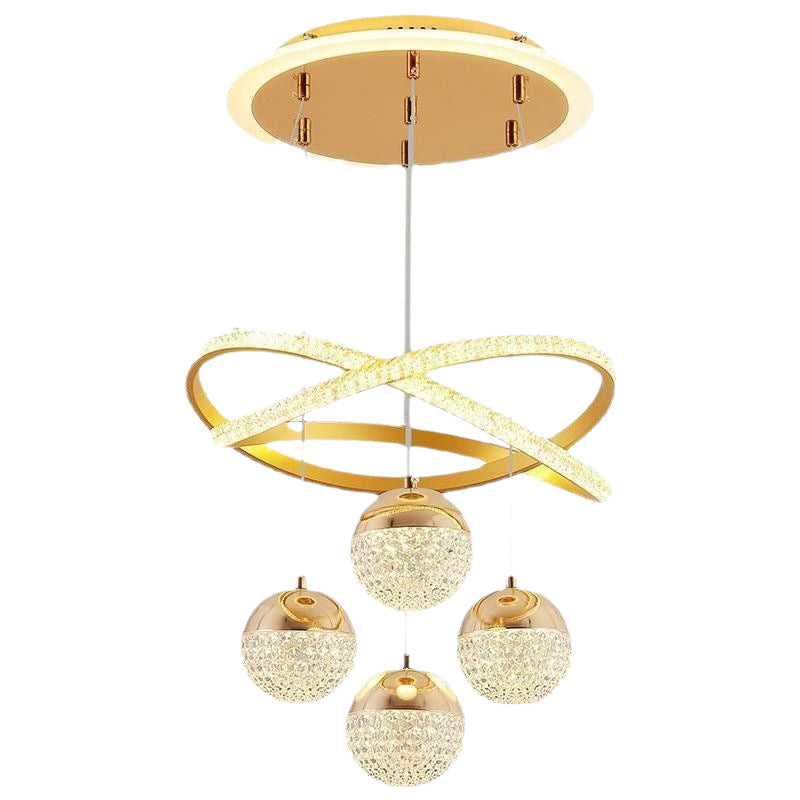 Gold chandelier with circular design and three spherical lights on a white background