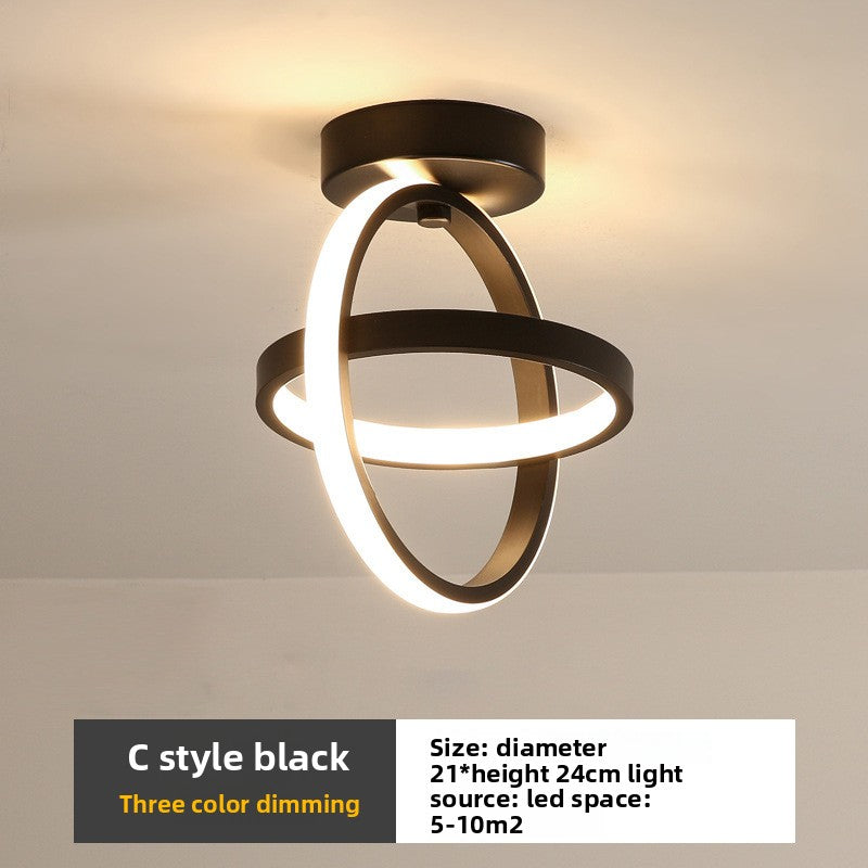 Modern ceiling light fixture with black finish on a neutral background