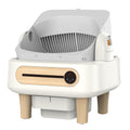 White pet litter box with wooden legs on a white background
