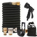 Black expandable garden hose with brass connectors and a black spray nozzle on a white background.