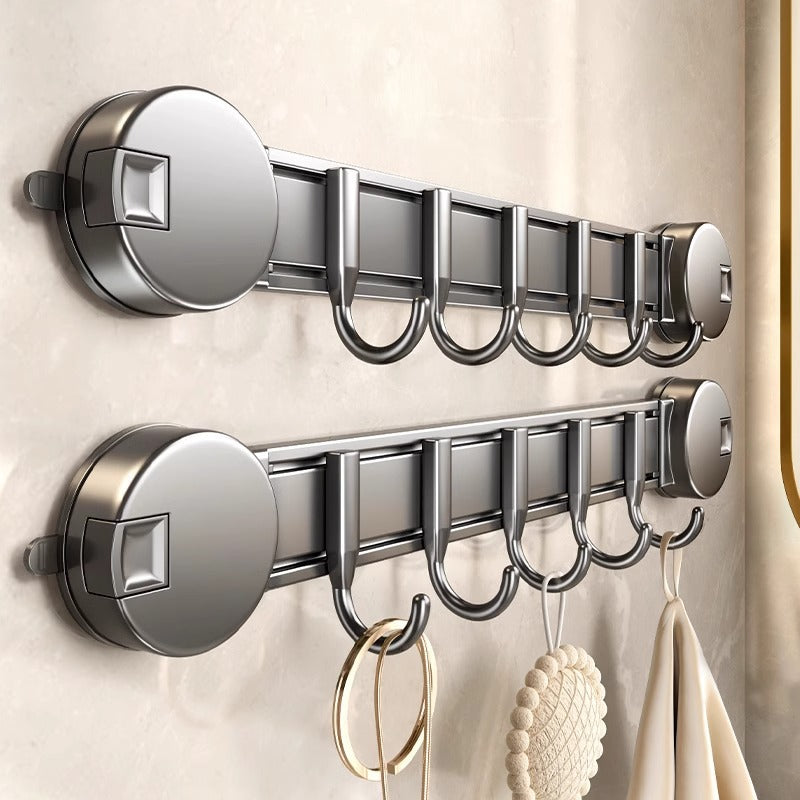 Metal wall hooks with multiple hooks on a neutral background