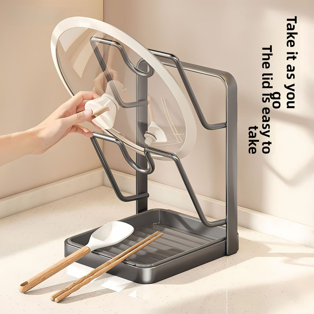 Gray kitchen utensil holder with a lid, spoon, and chopsticks on a light background.