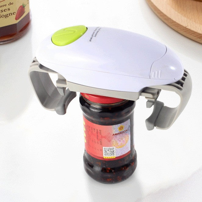 Bottle opener with a green button on top of a jar