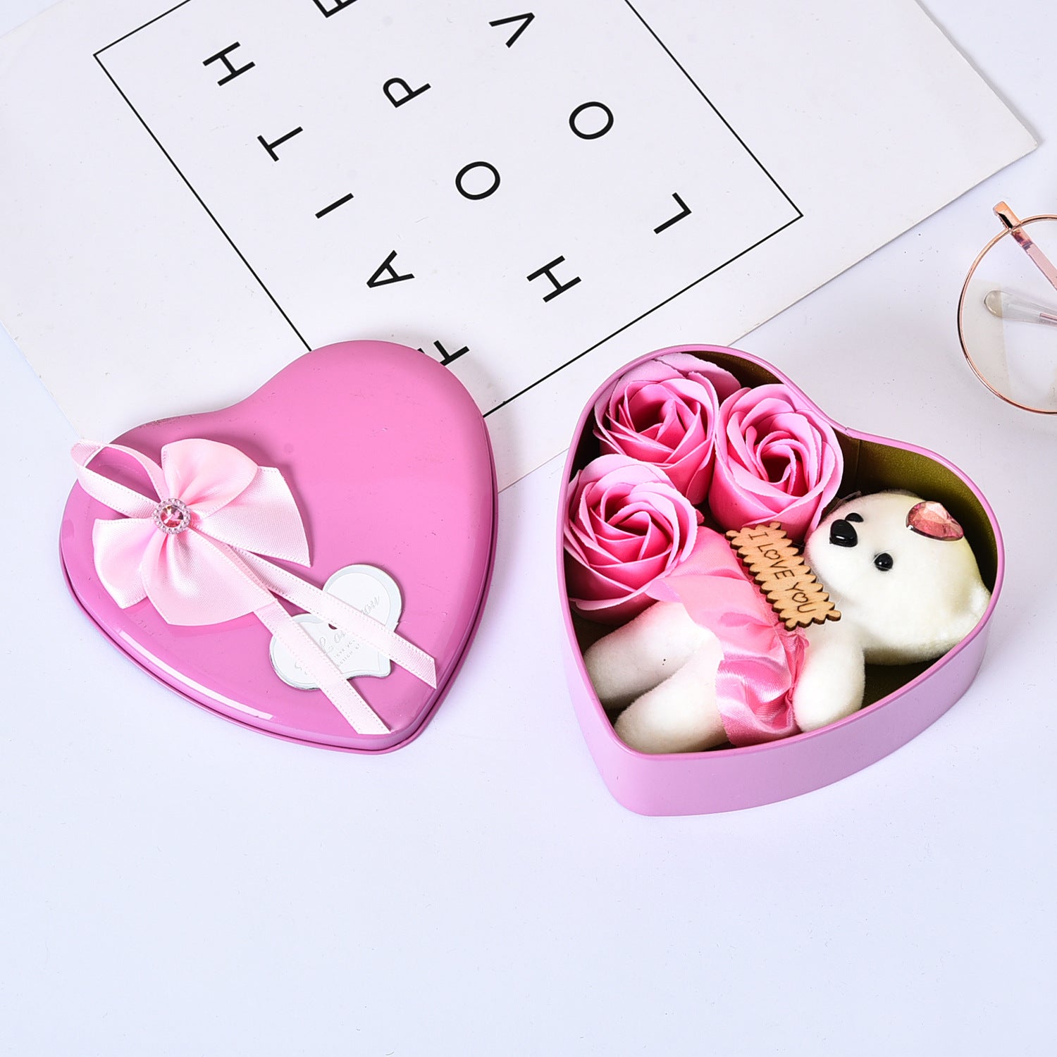 Heart-shaped pink gift box with a dog and rose design on a white background
