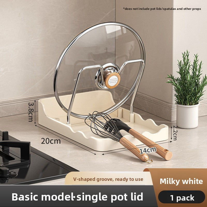 Kitchen pot lid with stand and measurements on a kitchen counter