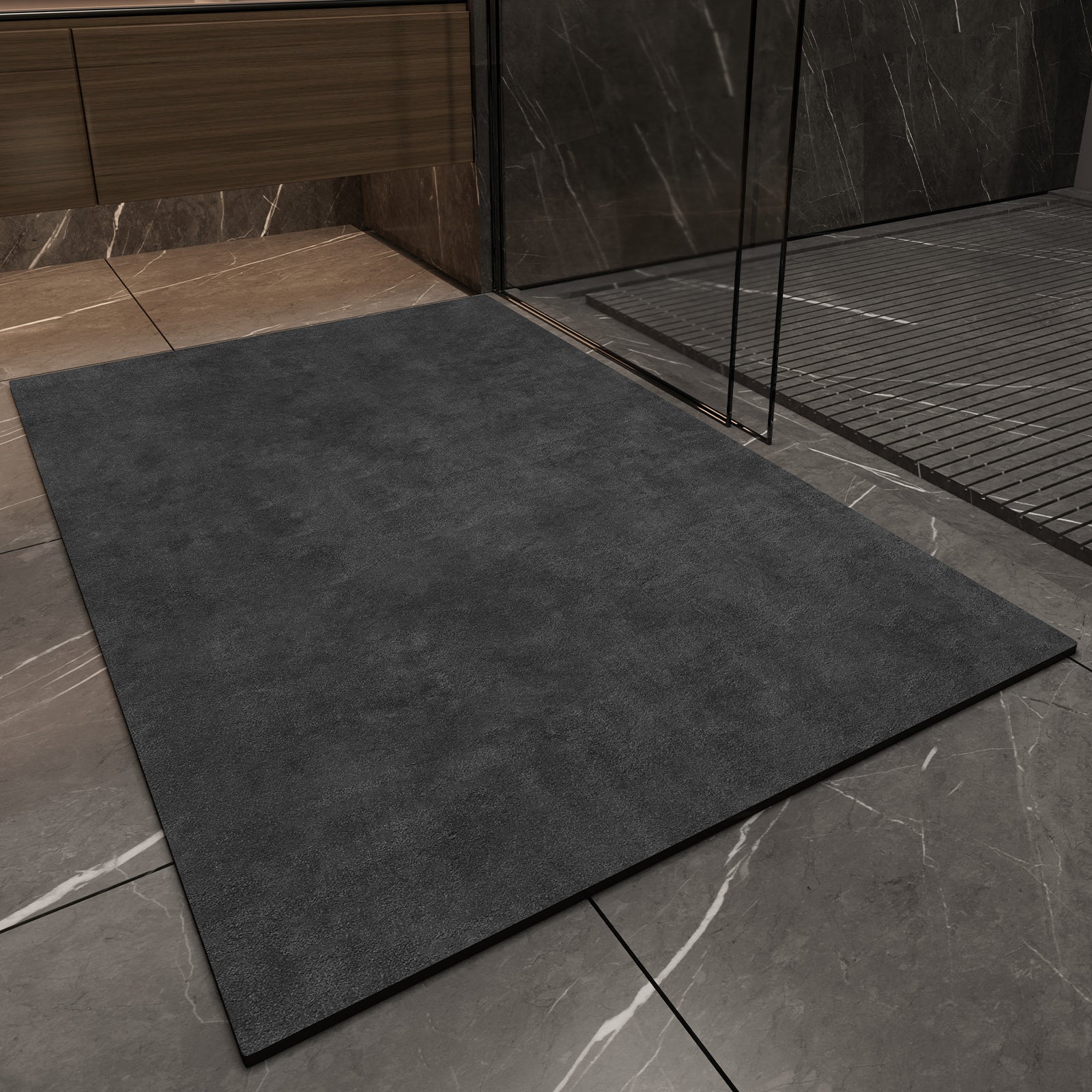 Dark gray mat on a tiled floor with a shower area in the background