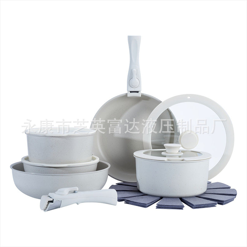 Set of gray cookware including pots, pans, and lids on a white background