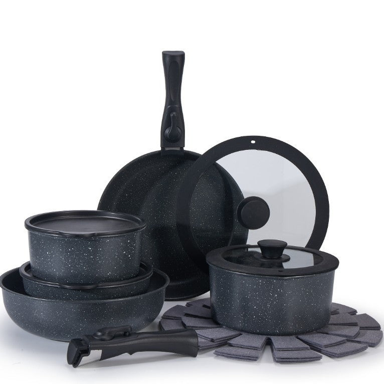 Set of black speckled cookware including pots, pans, and lids on a white background