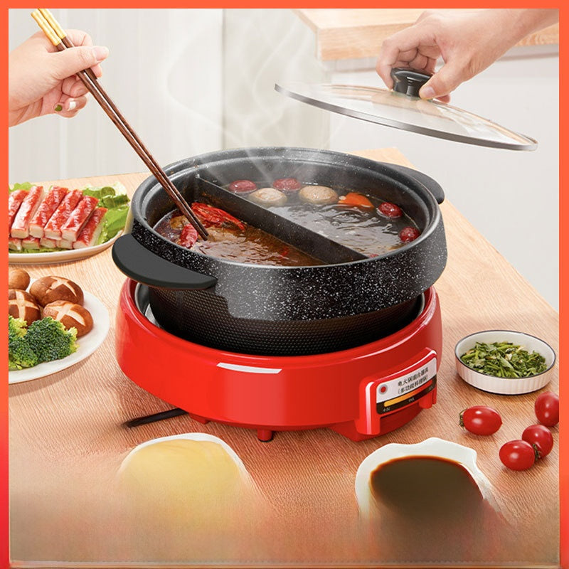 Red electric hot pot with food being cooked on a wooden table.