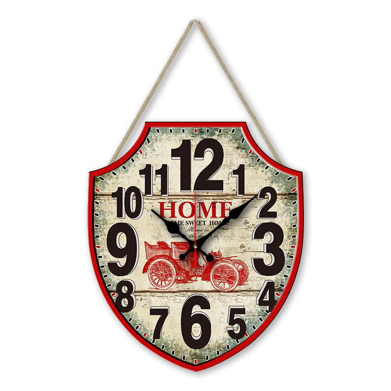 Decorative wall clock with vintage design and 'Home Sweet Home' text on a white background