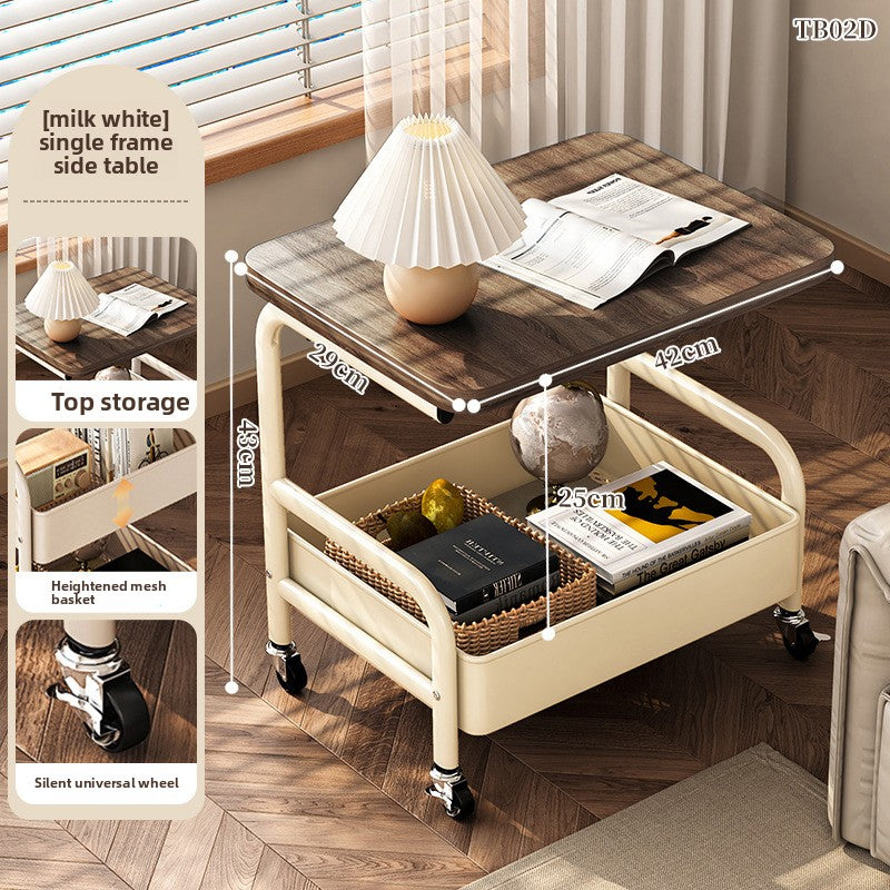 Multifunctional side table with top storage, heightened mesh basket, and wheels in a room setting.